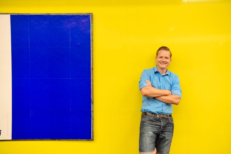 Paschi in front of a bright yellow background