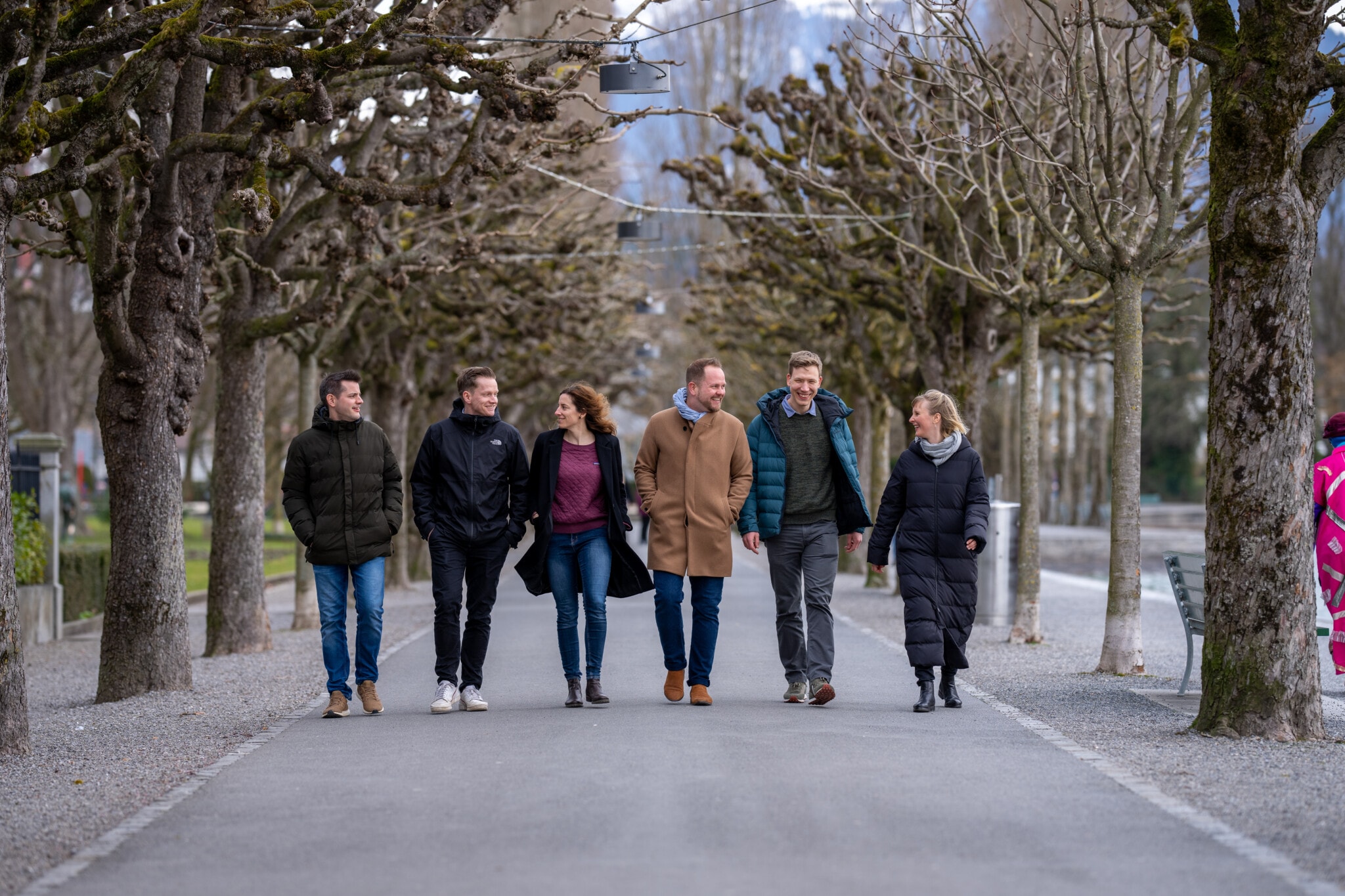 The required team on a walk along the lakeside promenade in Lucerne