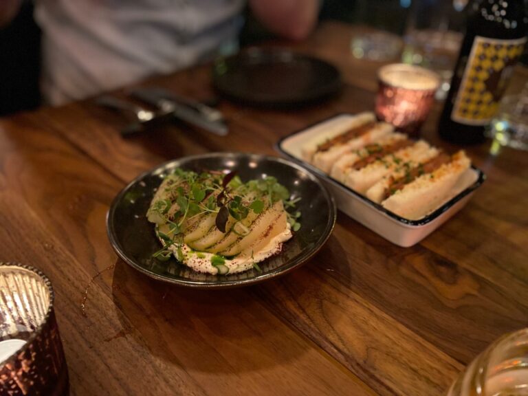 a bowl of food on a plate on a table