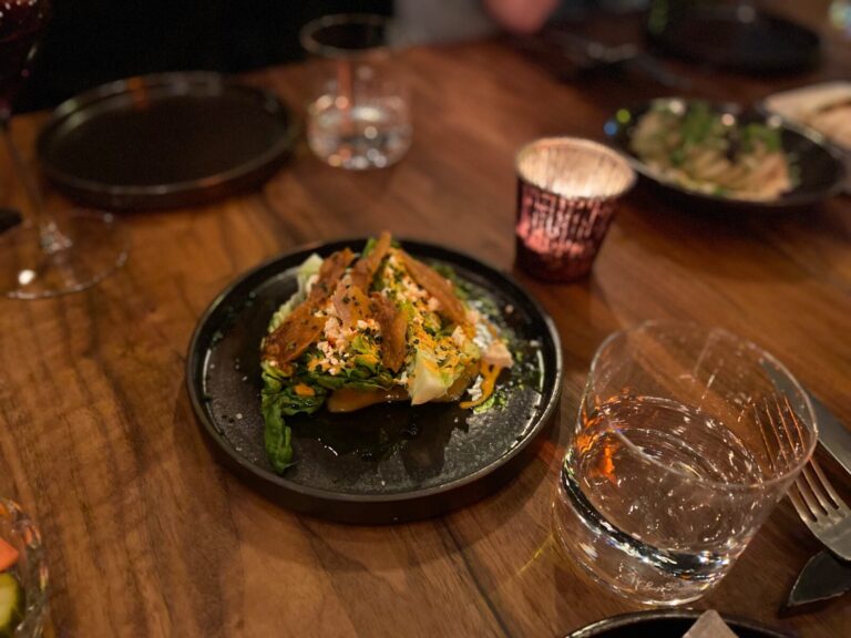 a bowl of food on a plate on a table