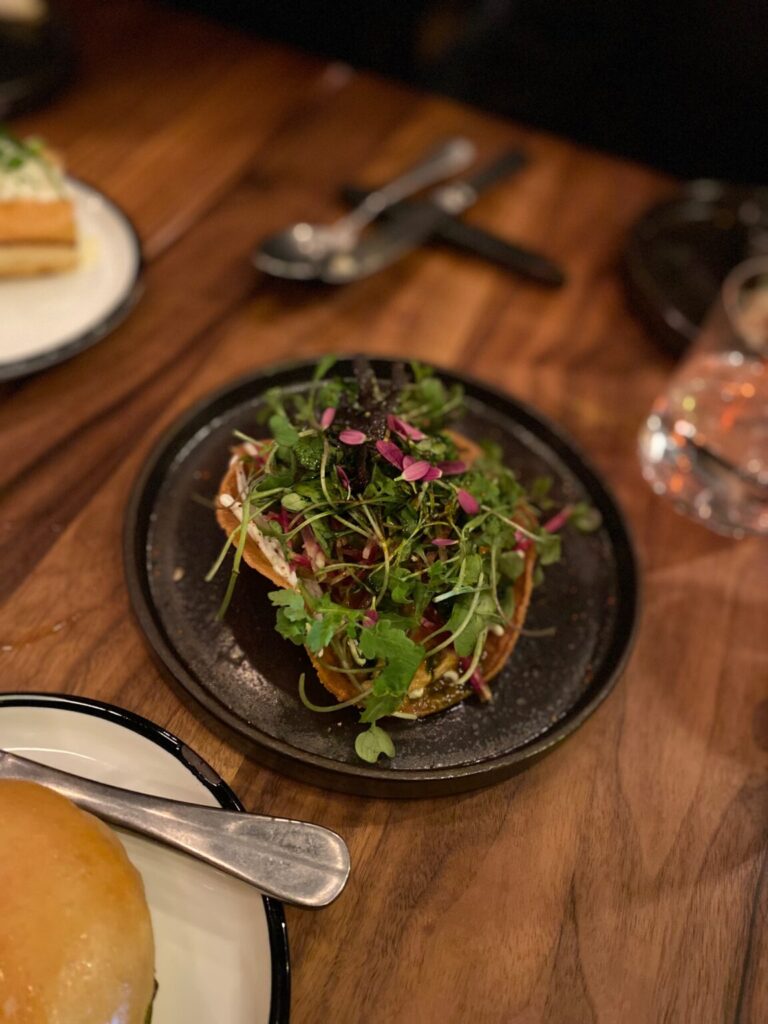 a bowl of food on a plate on a table
