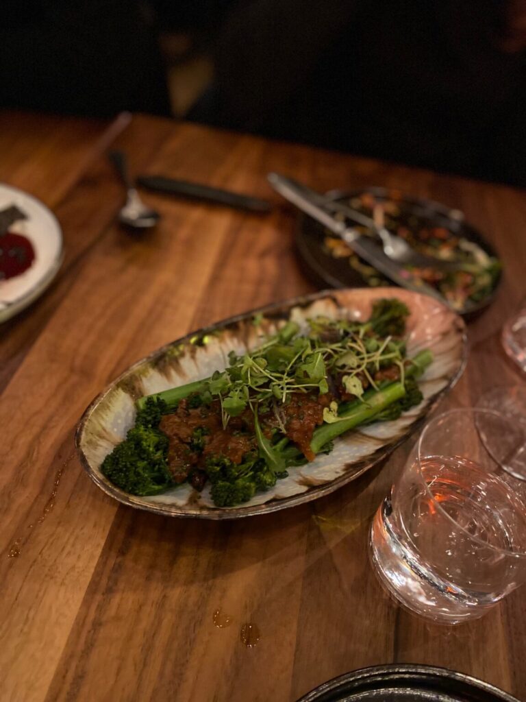 a bowl of food on a plate on a table