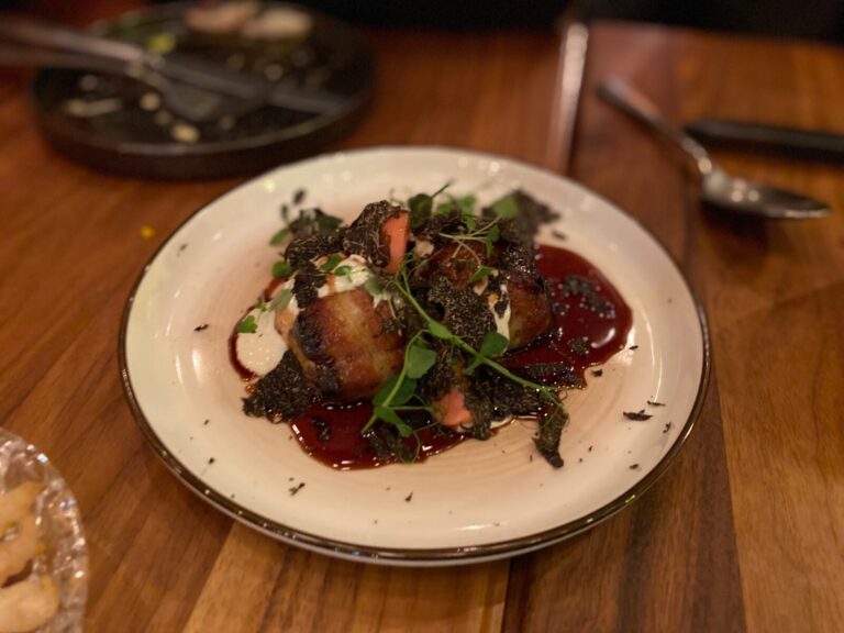 a bowl of food on a plate on a table