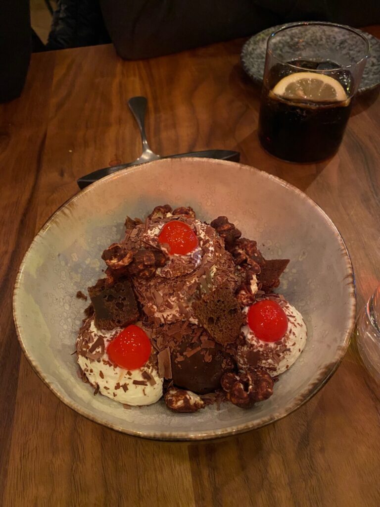 a bowl of food on a plate on a table