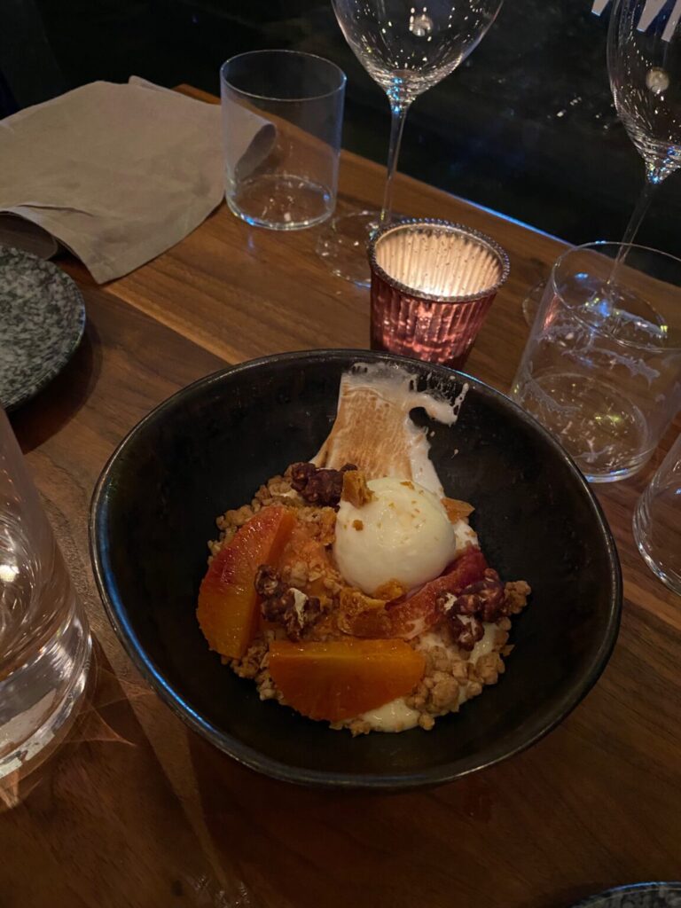a bowl of food on a plate on a table