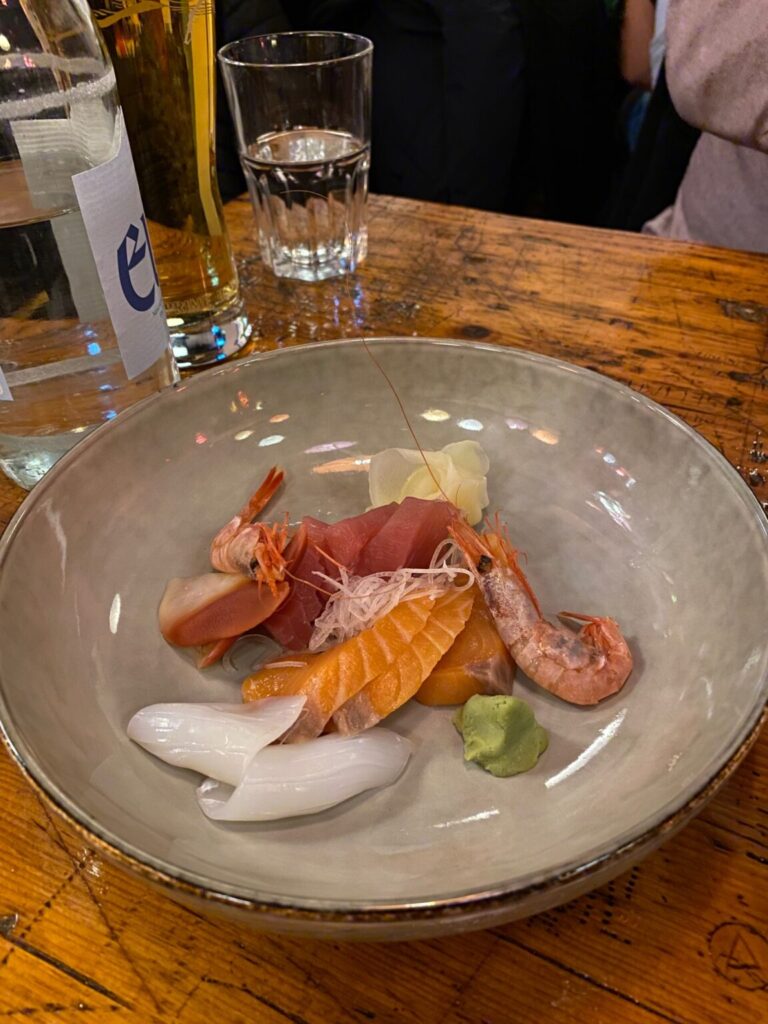 one with plates of sashimis