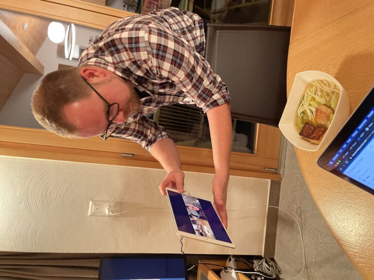 Velthy shows the soup to the other team members using Facetime on the tablet