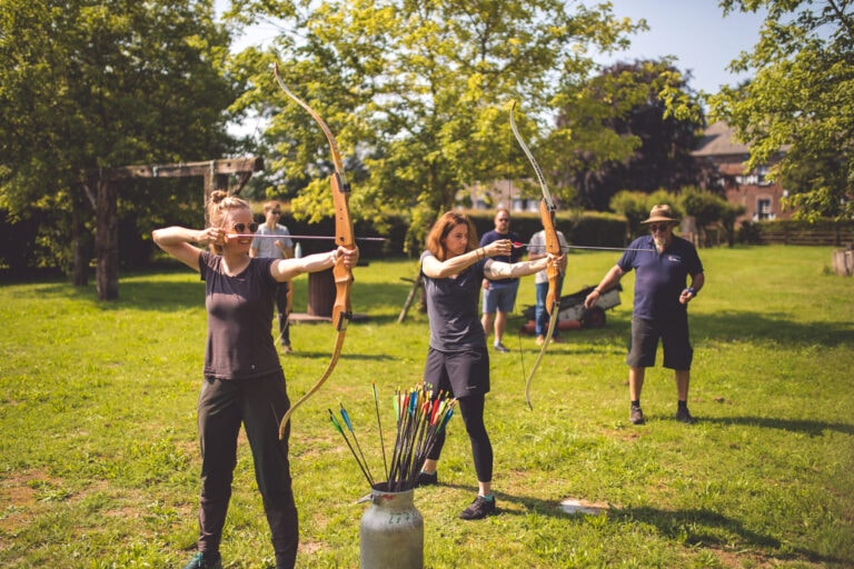 Corina and Karin shooting bows and arrows
