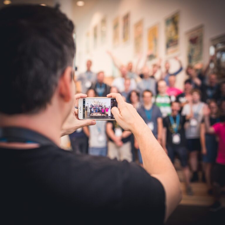 Photo of a person taking a group photo of the participants