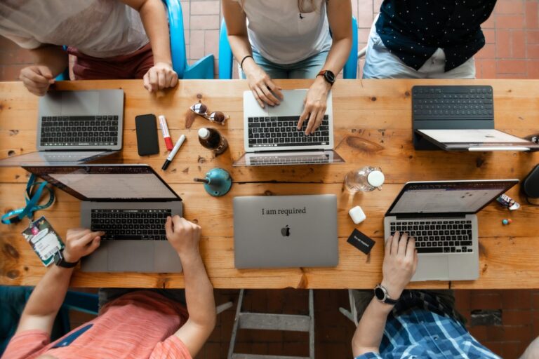 The required team with their laptops in Berlin, photographed from above.