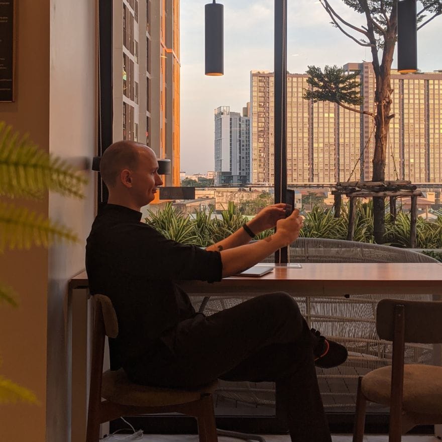 Simon in a coffee shop in Bangkok.