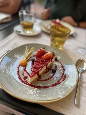 Panna cotta served on a plate with garnish.