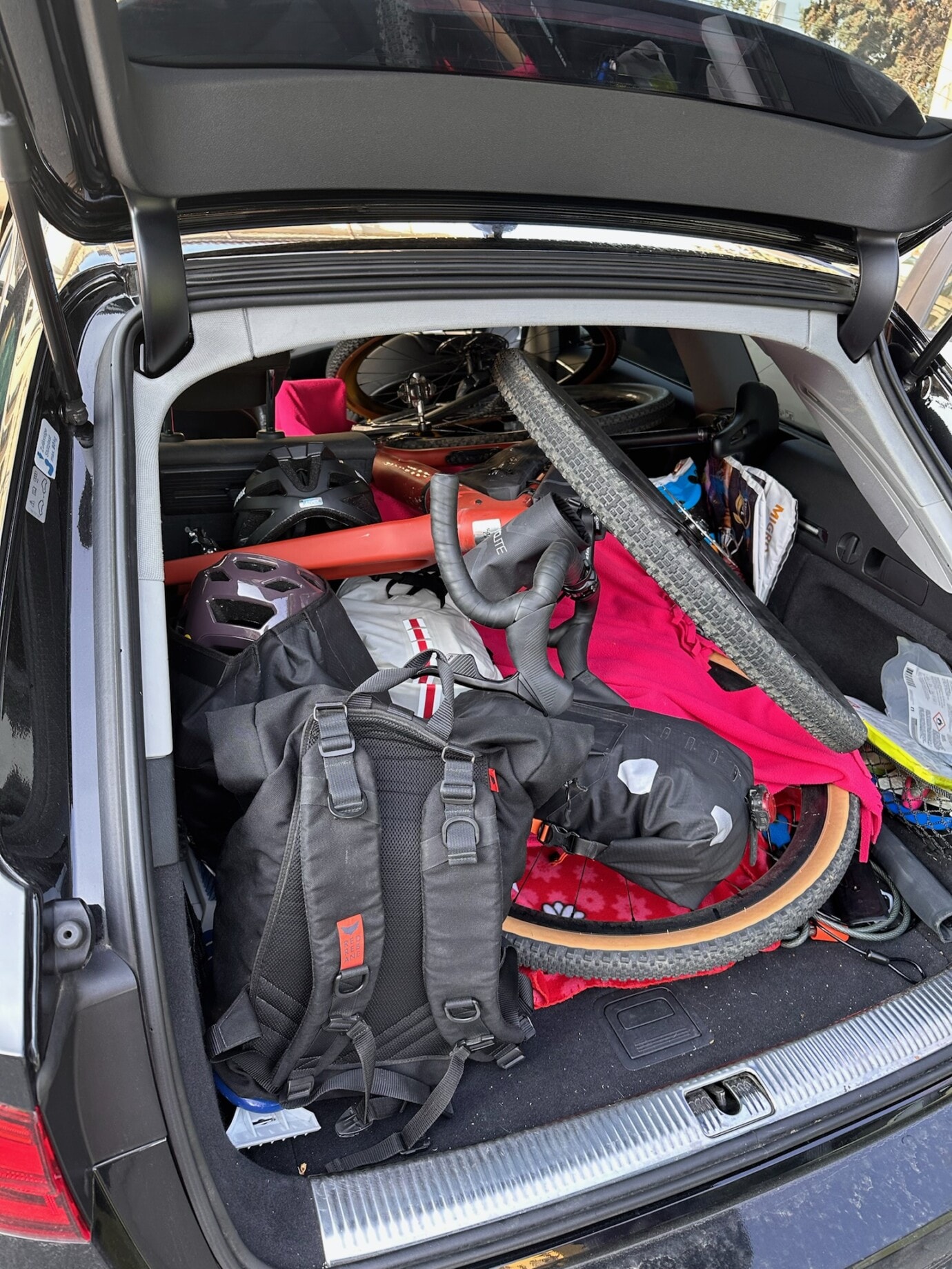 Karin and Dominik's bikes in the trunk of a car.