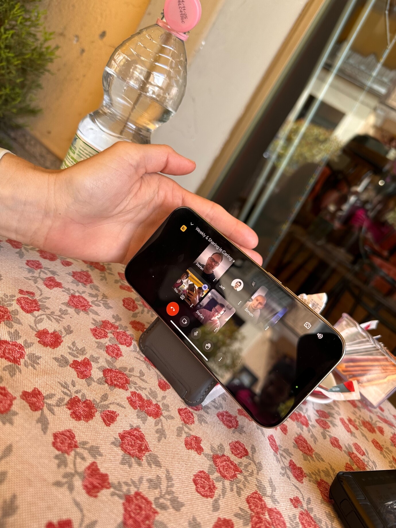 Photo of cell phone with which the team took part in the team meeting.