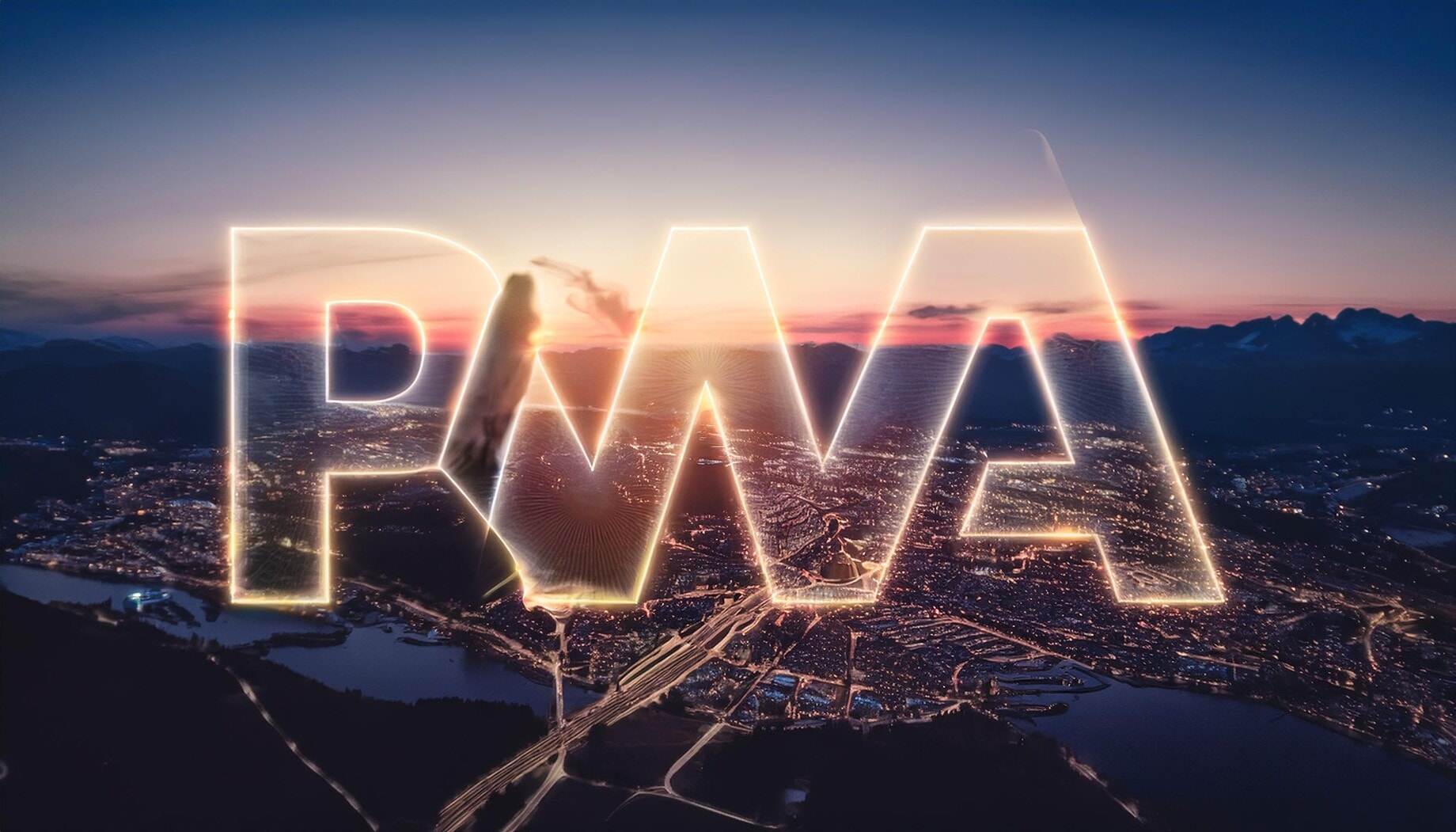 Beleuchtetes PWA-Logo über einer Stadtlandschaft bei Sonnenuntergang, symbolisiert die Fortschritte der Progressive Web-App Technologie.