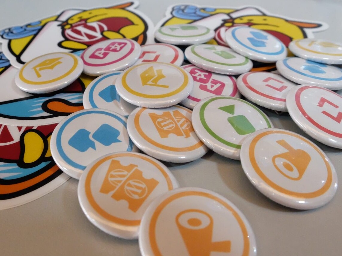 Contributor pins at a Contributor Day.