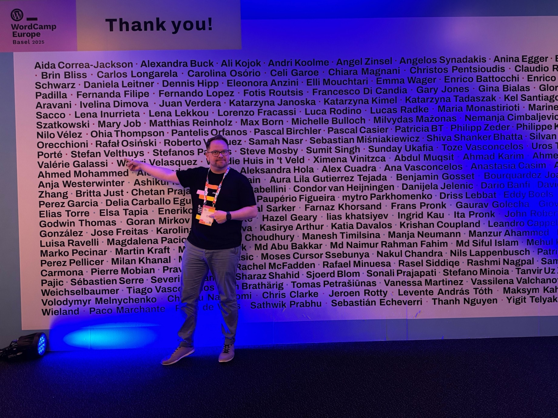 WordCamp Europe 2025: Velthy on illuminated stage in front of thank-you wall with sponsors' names